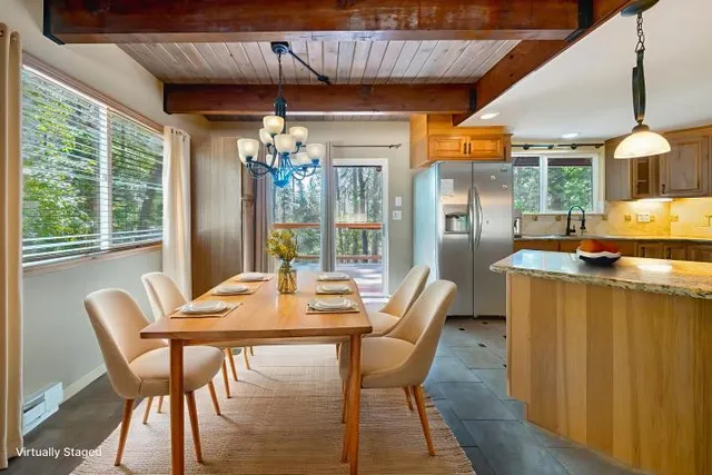a dining room with furniture and window