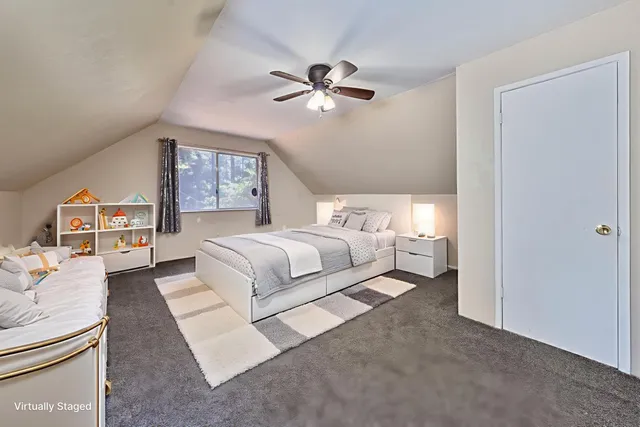an empty room with fan and ceiling fan