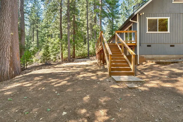 a view of a patio with a table and chairs