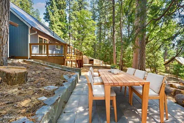 a view of a roof deck with wooden floor and fence