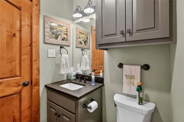 a bathroom with a sink a mirror and a shower
