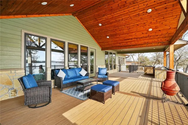 a view of balcony with couch and wooden floor