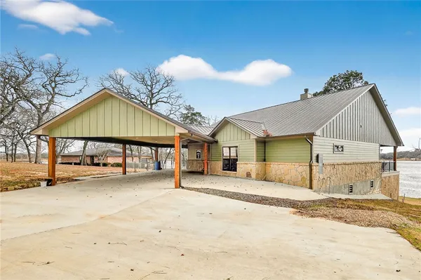 a view of a house with a yard and garage