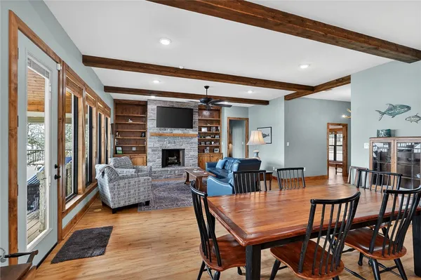 a living room with fireplace furniture and a wooden floor