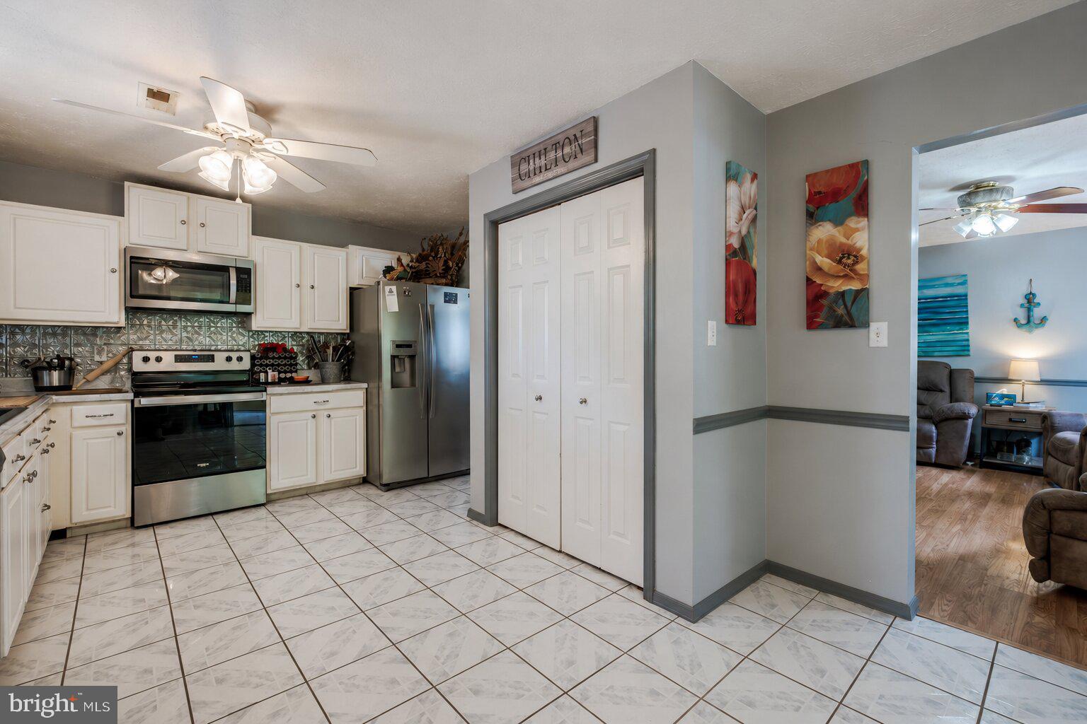 11419 Oak Grove Road Bristol, VA 24202 - Photo 11 of 36 a kitchen with stainless steel appliances a refrigerator sink and microwave