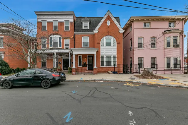 a car parked in front of a house
