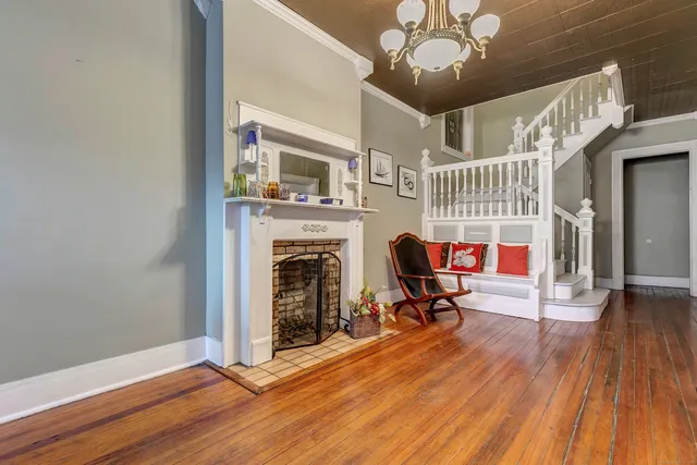 a view of a livingroom with furniture and a fireplace