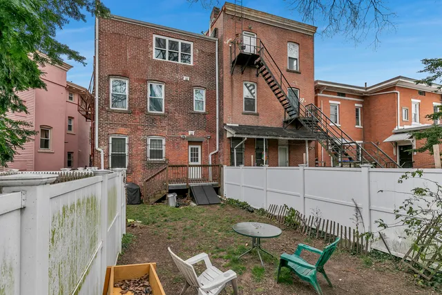 a view of a patio with a table and chairs