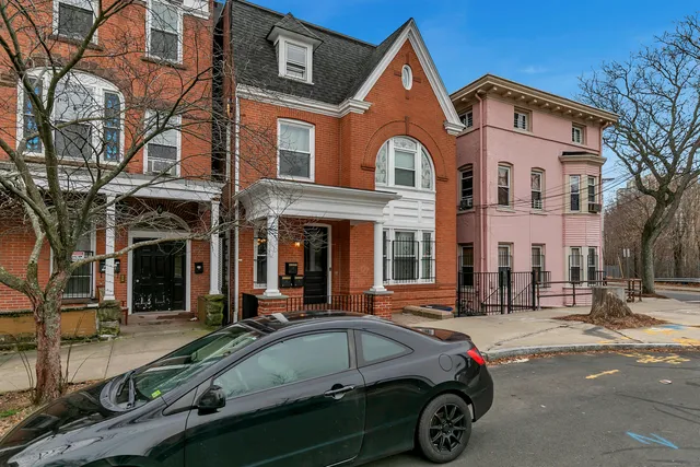 a car parked in front of a building