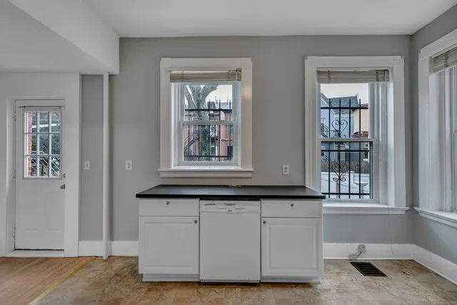 a view of a sink and a window in a room