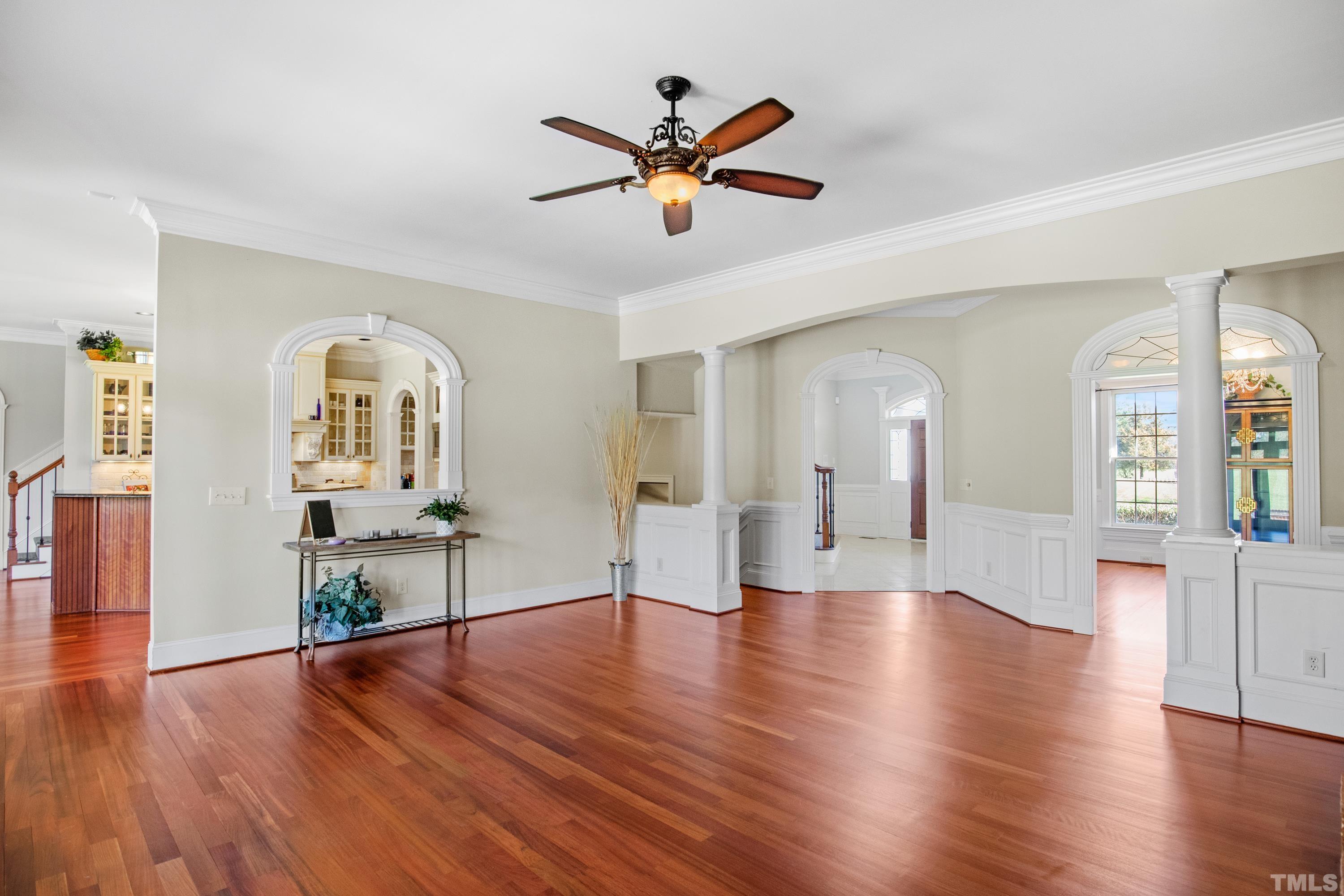 6437 Wakefalls Drive Wake Forest, NC 27587 - Photo 14 of 76 a view of a livingroom with wooden floor and a ceiling fan