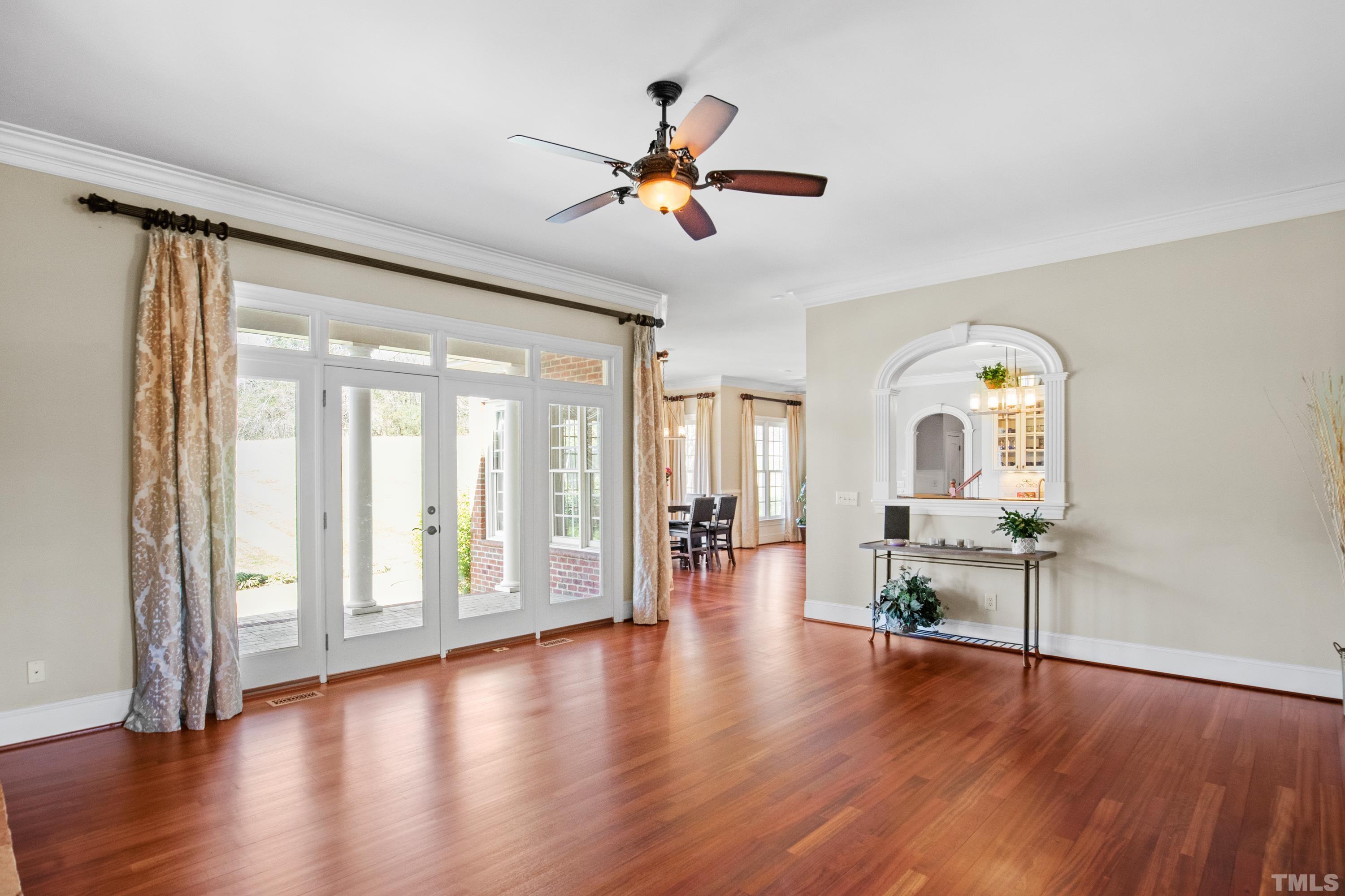 6437 Wakefalls Drive Wake Forest, NC 27587 - Photo 15 of 76 a view of empty room with wooden floor and fan