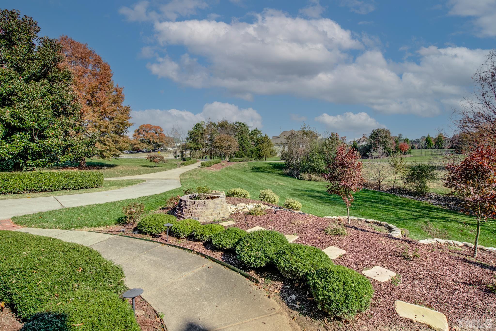 6437 Wakefalls Drive Wake Forest, NC 27587 - Photo 3 of 76 a view of a garden with a building in the background