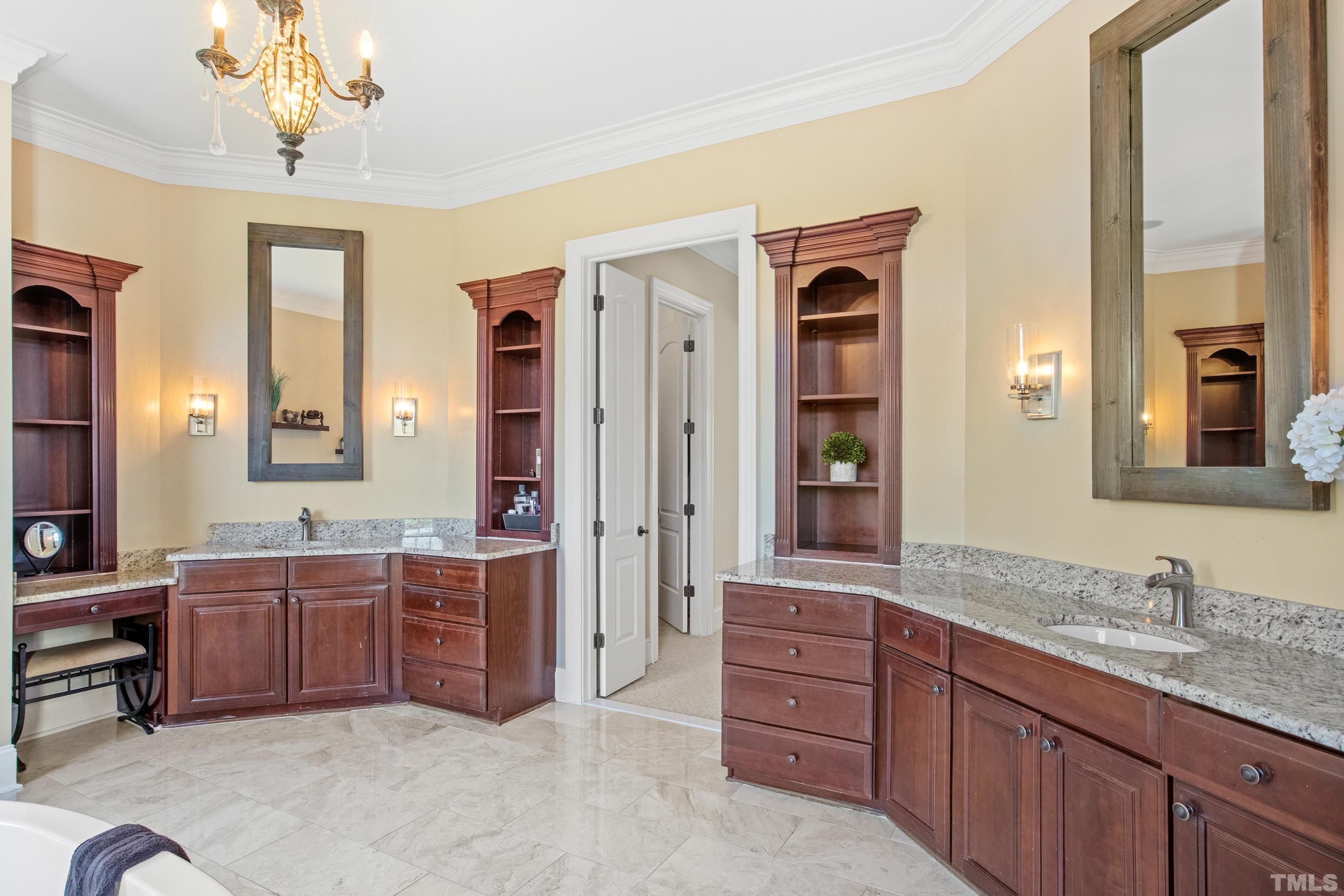 6437 Wakefalls Drive Wake Forest, NC 27587 - Photo 33 of 76 a spacious bathroom with a granite countertop sink and a mirror