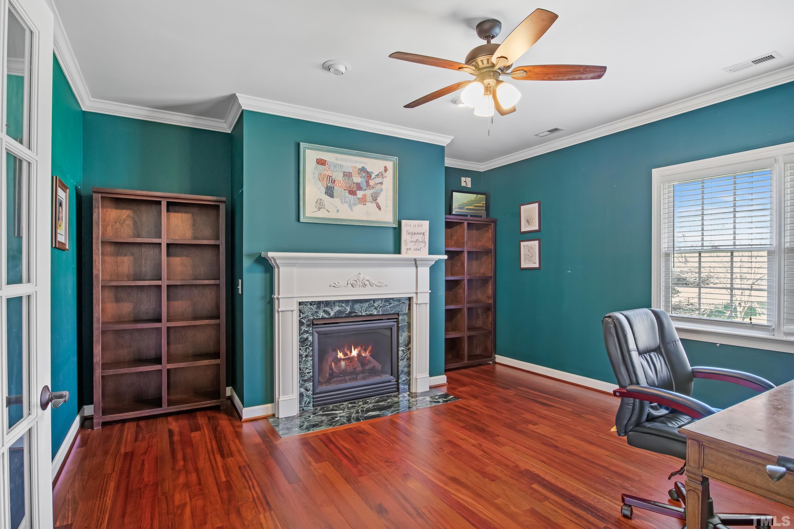 6437 Wakefalls Drive Wake Forest, NC 27587 - Photo 36 of 76 a living room with furniture and a fireplace