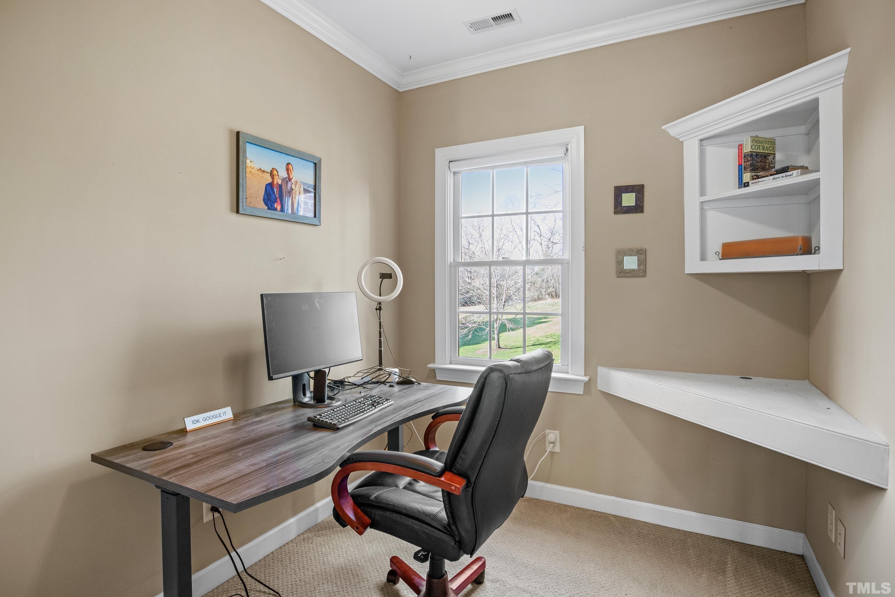 6437 Wakefalls Drive Wake Forest, NC 27587 - Photo 37 of 76 a view of a workspace with furniture and a window