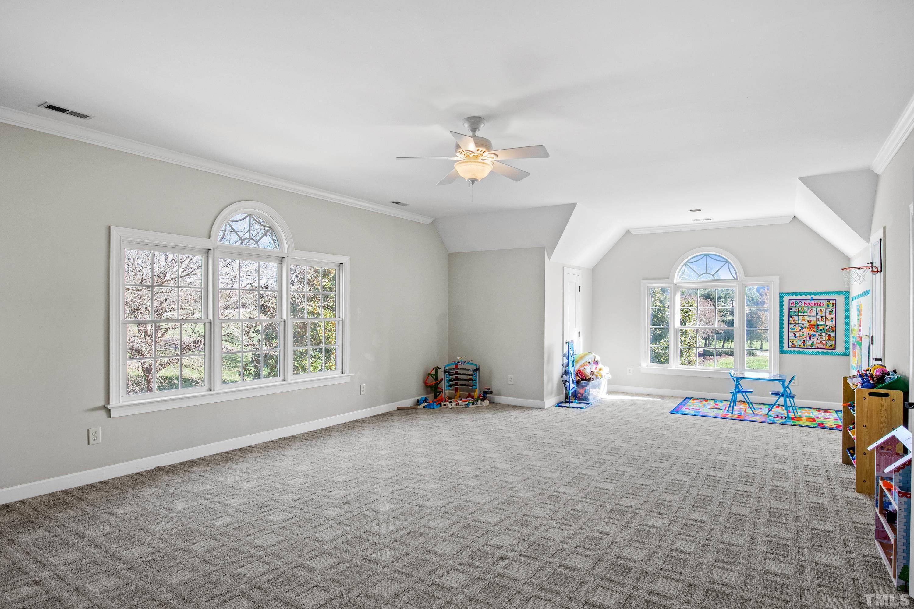 6437 Wakefalls Drive Wake Forest, NC 27587 - Photo 38 of 76 a living room with furniture and a large window