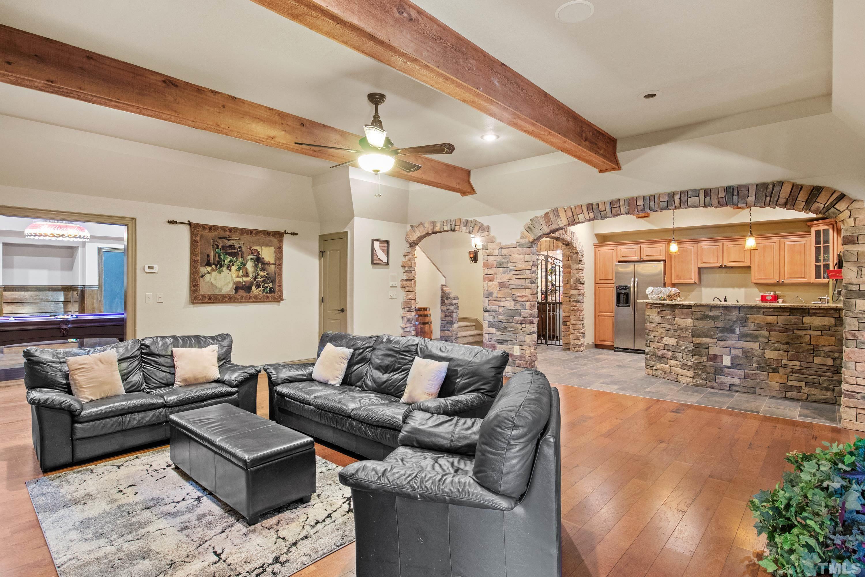 6437 Wakefalls Drive Wake Forest, NC 27587 - Photo 52 of 76 a living room with furniture and a large window