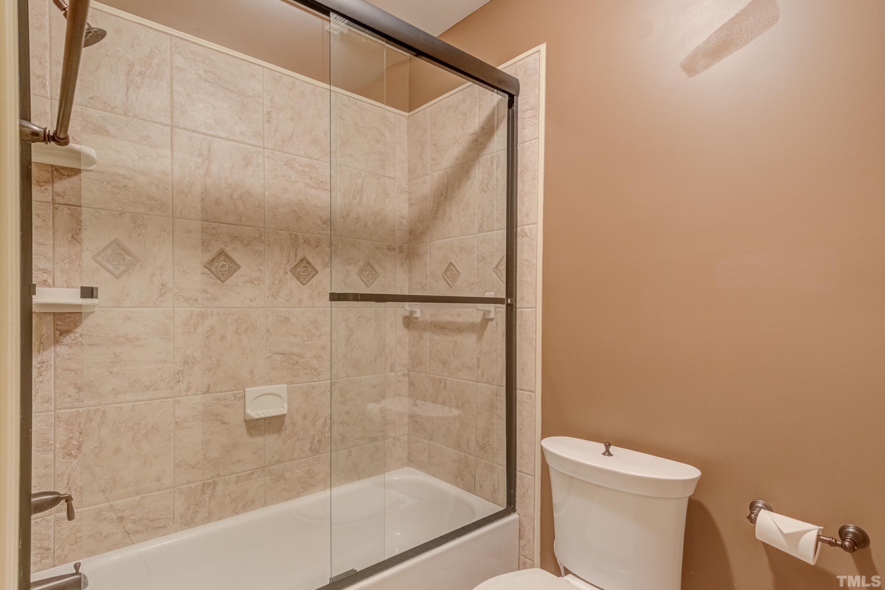 6437 Wakefalls Drive Wake Forest, NC 27587 - Photo 59 of 76 a bathroom with a shower and a toilet