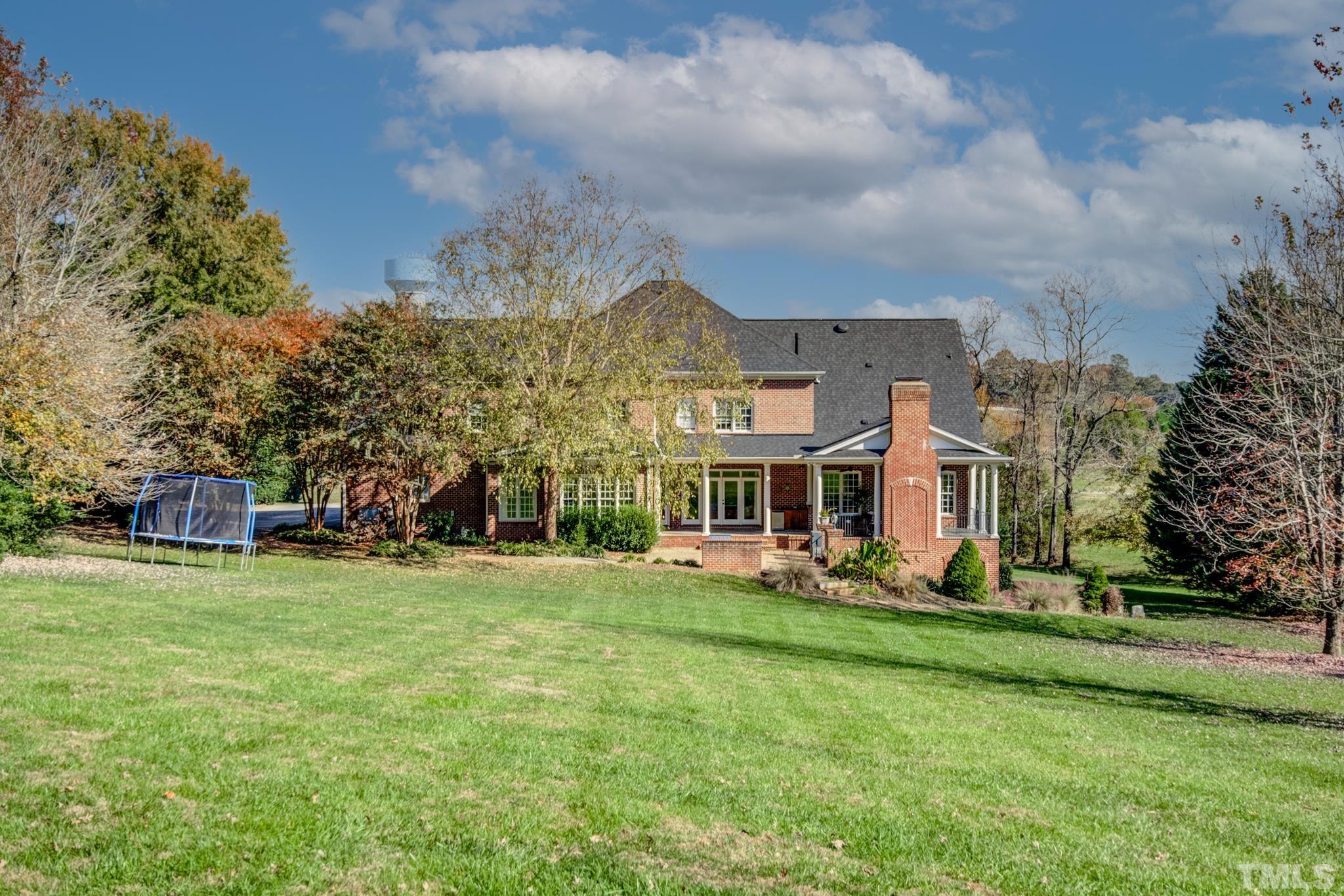 6437 Wakefalls Drive Wake Forest, NC 27587 - Photo 72 of 76 a view of a house with a big yard and large trees