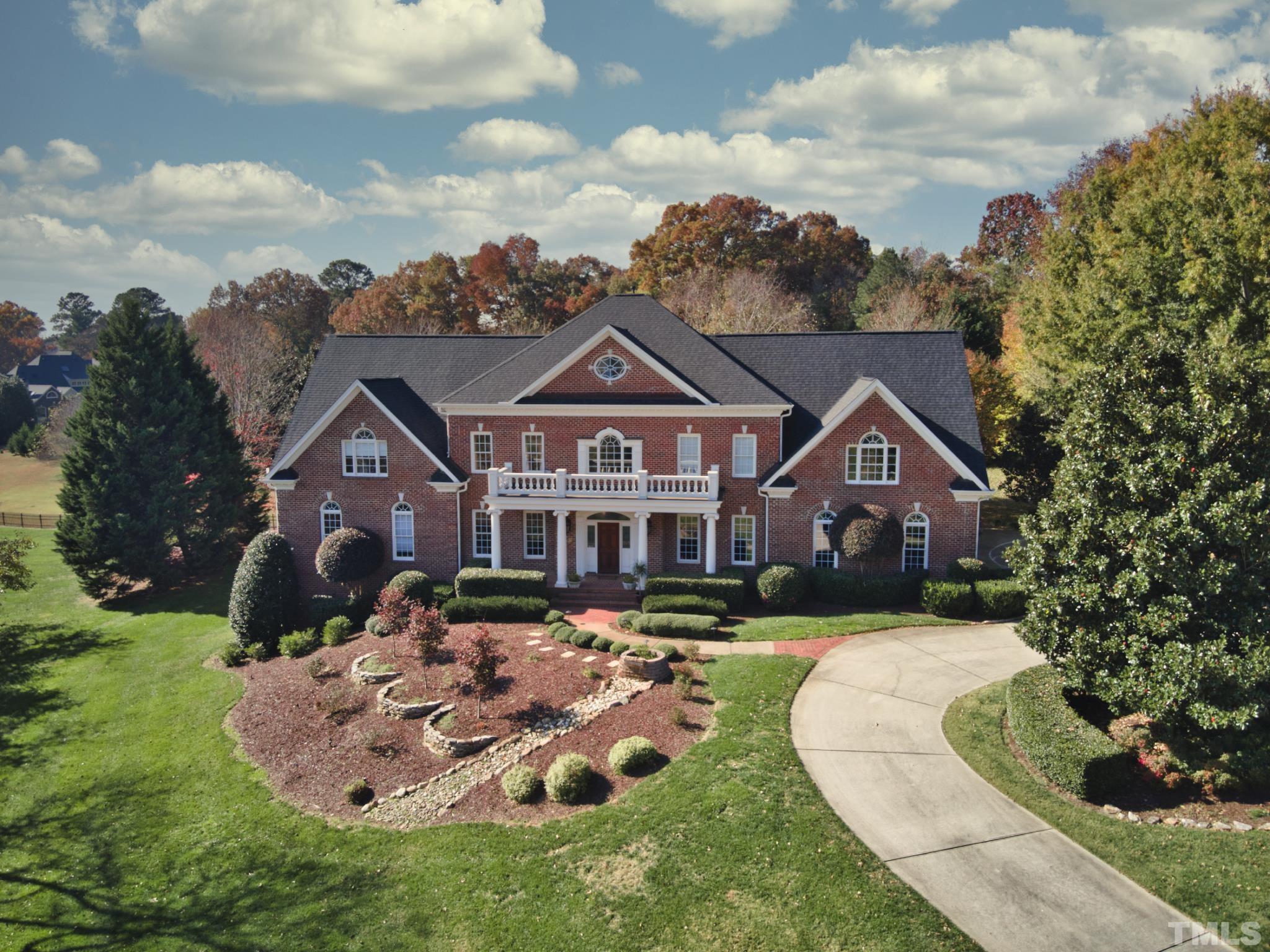 6437 Wakefalls Drive Wake Forest, NC 27587 - Photo 74 of 76 a front view of a house with garden