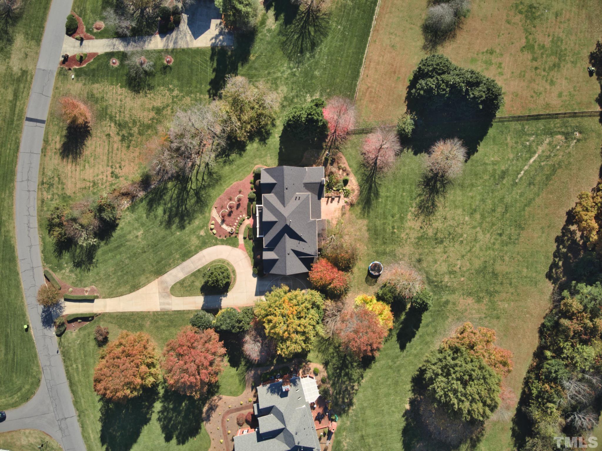 6437 Wakefalls Drive Wake Forest, NC 27587 - Photo 75 of 76 an aerial view of a house with a yard and potted plants