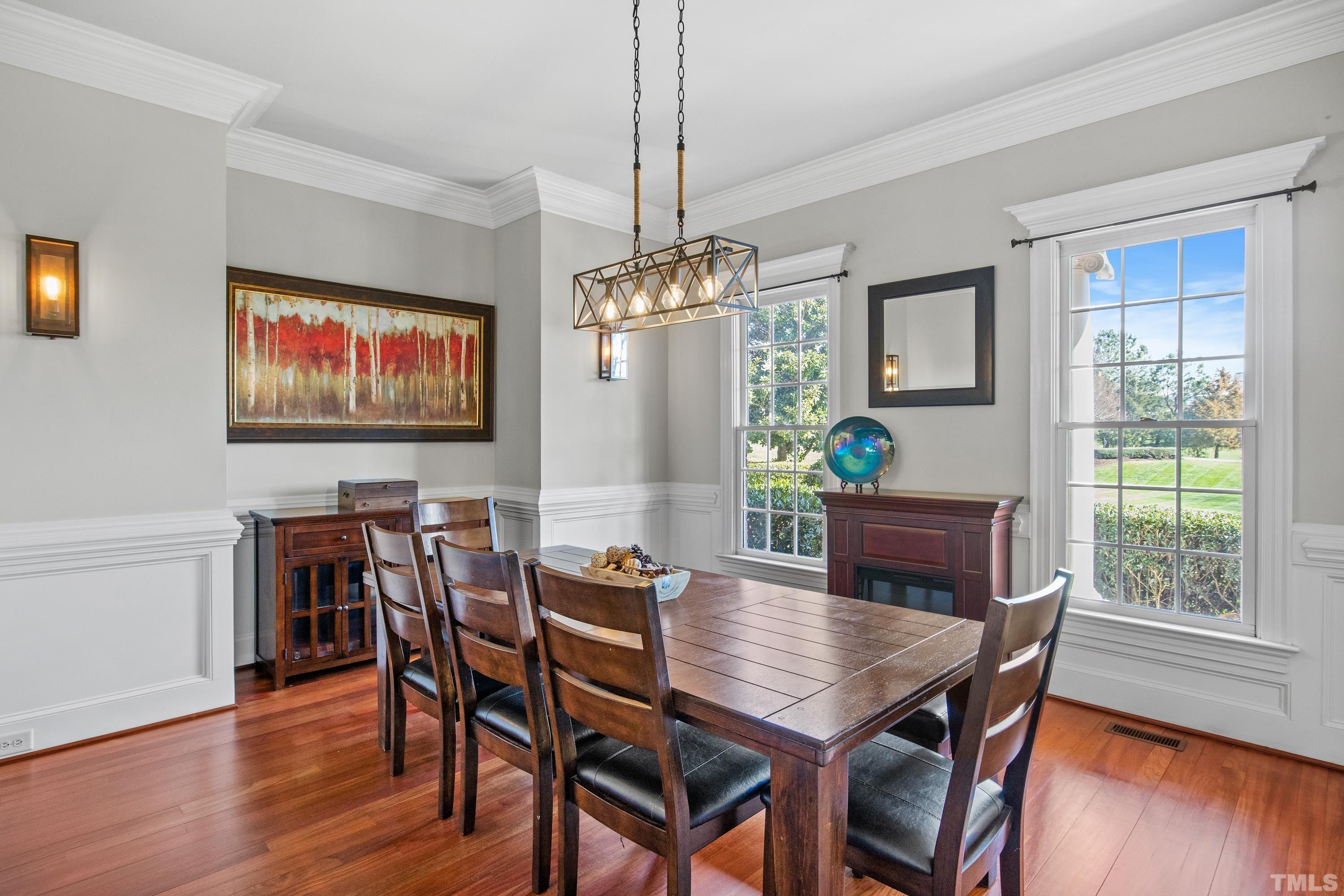 6437 Wakefalls Drive Wake Forest, NC 27587 - Photo 10 of 76 a view of a dining room with furniture window and wooden floor