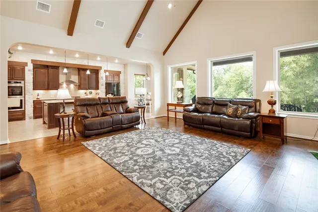 a living room with fireplace furniture and a flat screen tv