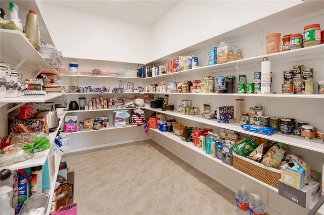 a bedroom with a bed and a television