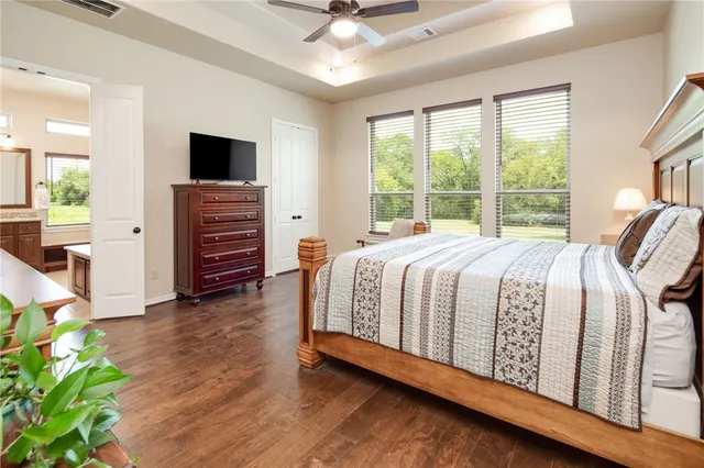 a bedroom with a bed and a couch