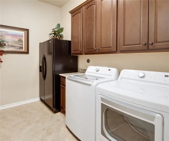 a living room with furniture and floor to ceiling windows