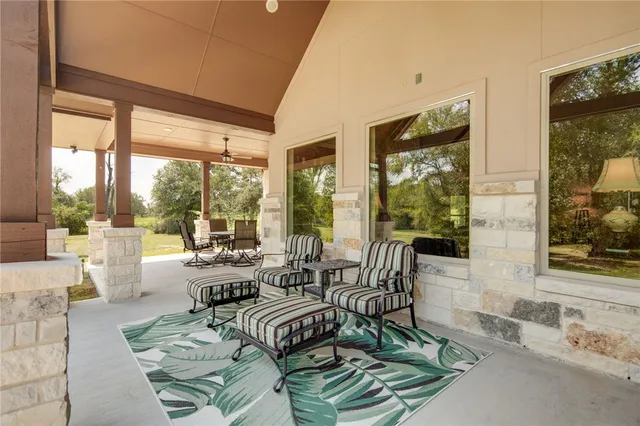 a view of a livingroom with furniture and a flat screen tv