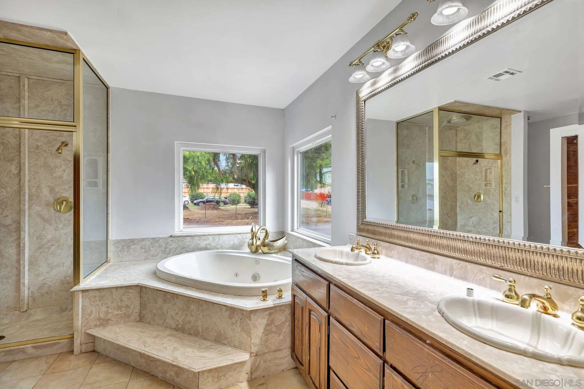 14414 Poway Road Poway, CA 92064 - Photo 17 of 27 a bathroom with a sink double vanity and a mirror