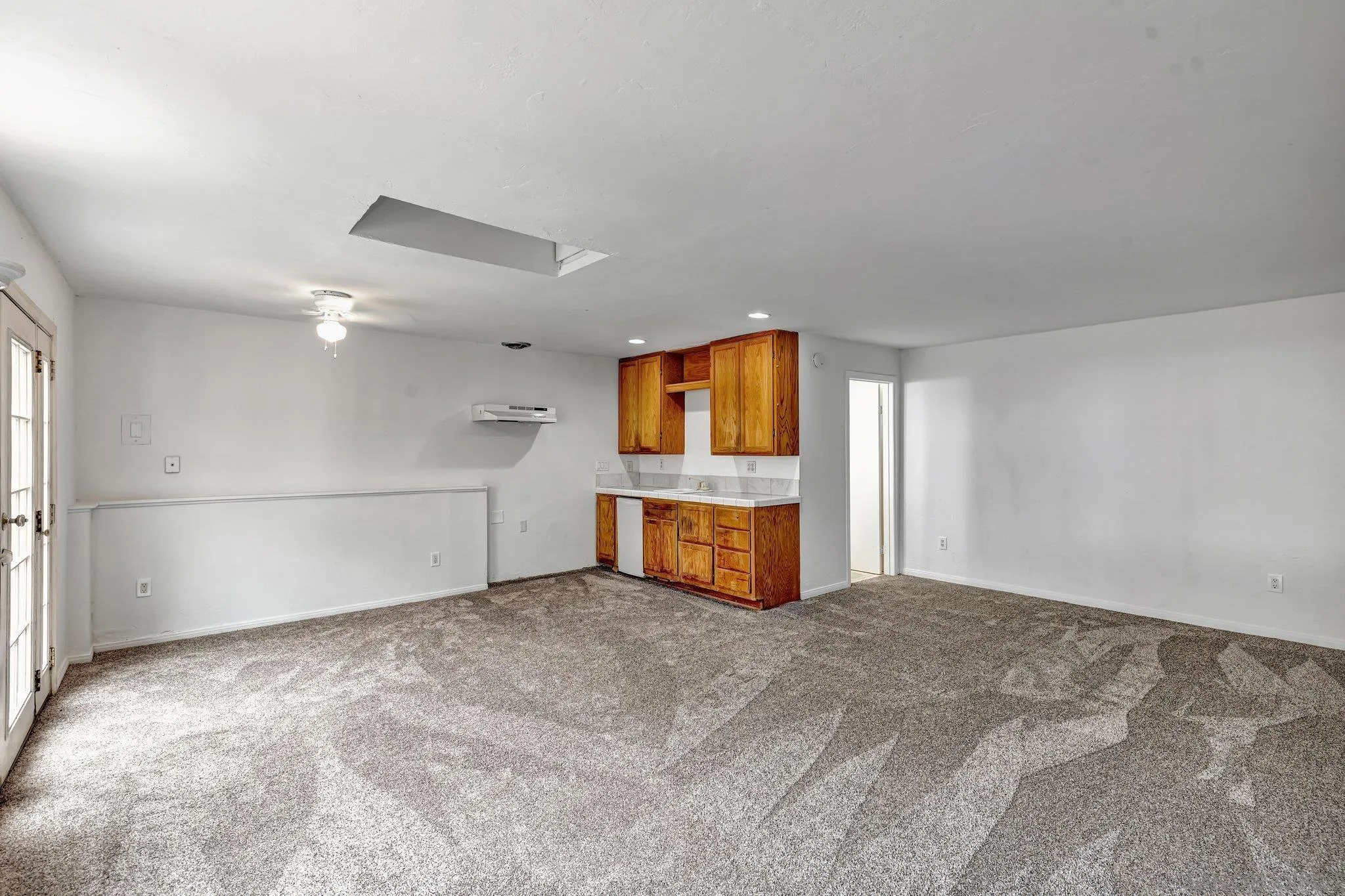 14414 Poway Road Poway, CA 92064 - Photo 26 of 27 a view of a kitchen with a sink and dishwasher a kitchen island with wooden floor