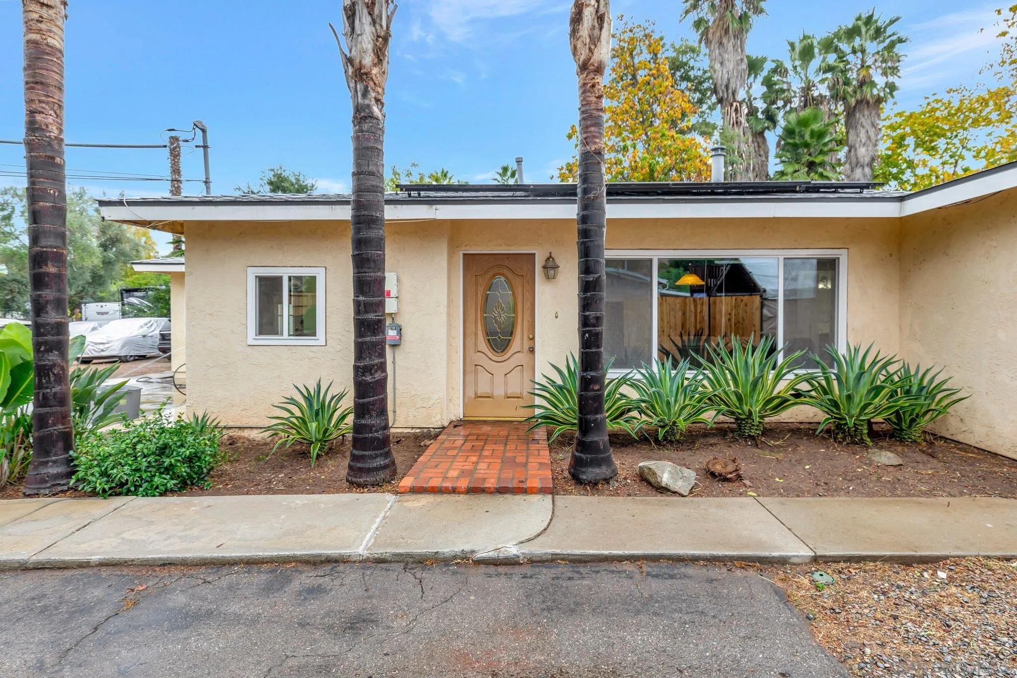 14414 Poway Road Poway, CA 92064 - Photo 4 of 27 a front view of a house with a yard