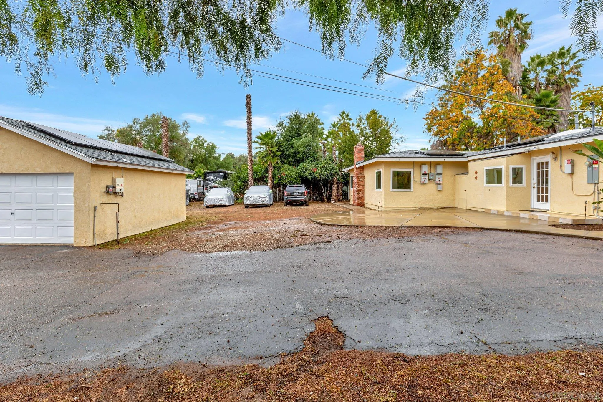 14414 Poway Road Poway, CA 92064 - Photo 5 of 27 a front view of a house with a yard and garage