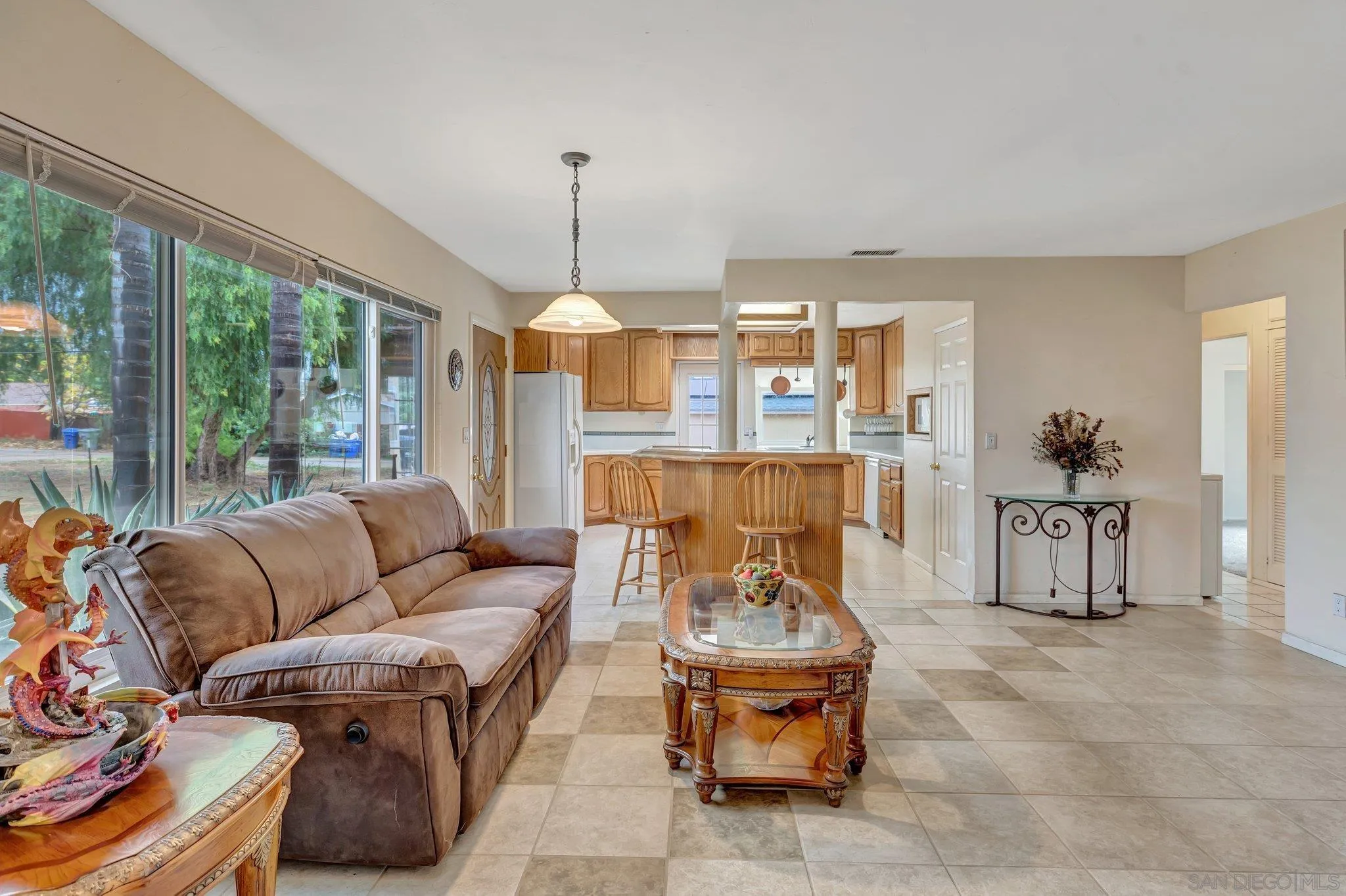 14414 Poway Road Poway, CA 92064 - Photo 9 of 27 a living room with furniture and a floor to ceiling window