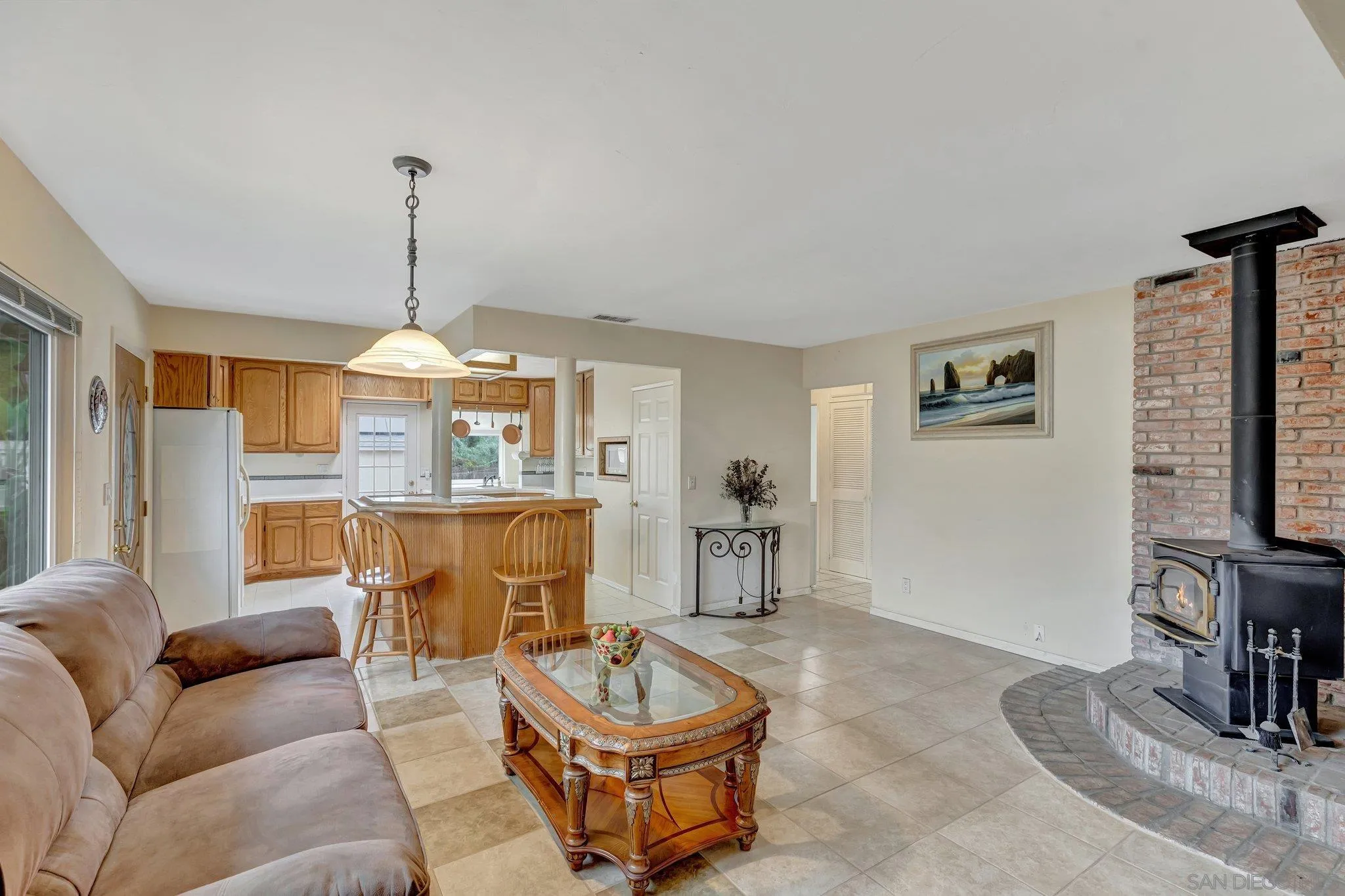14414 Poway Road Poway, CA 92064 - Photo 10 of 27 a living room with furniture a fireplace and a flat screen tv
