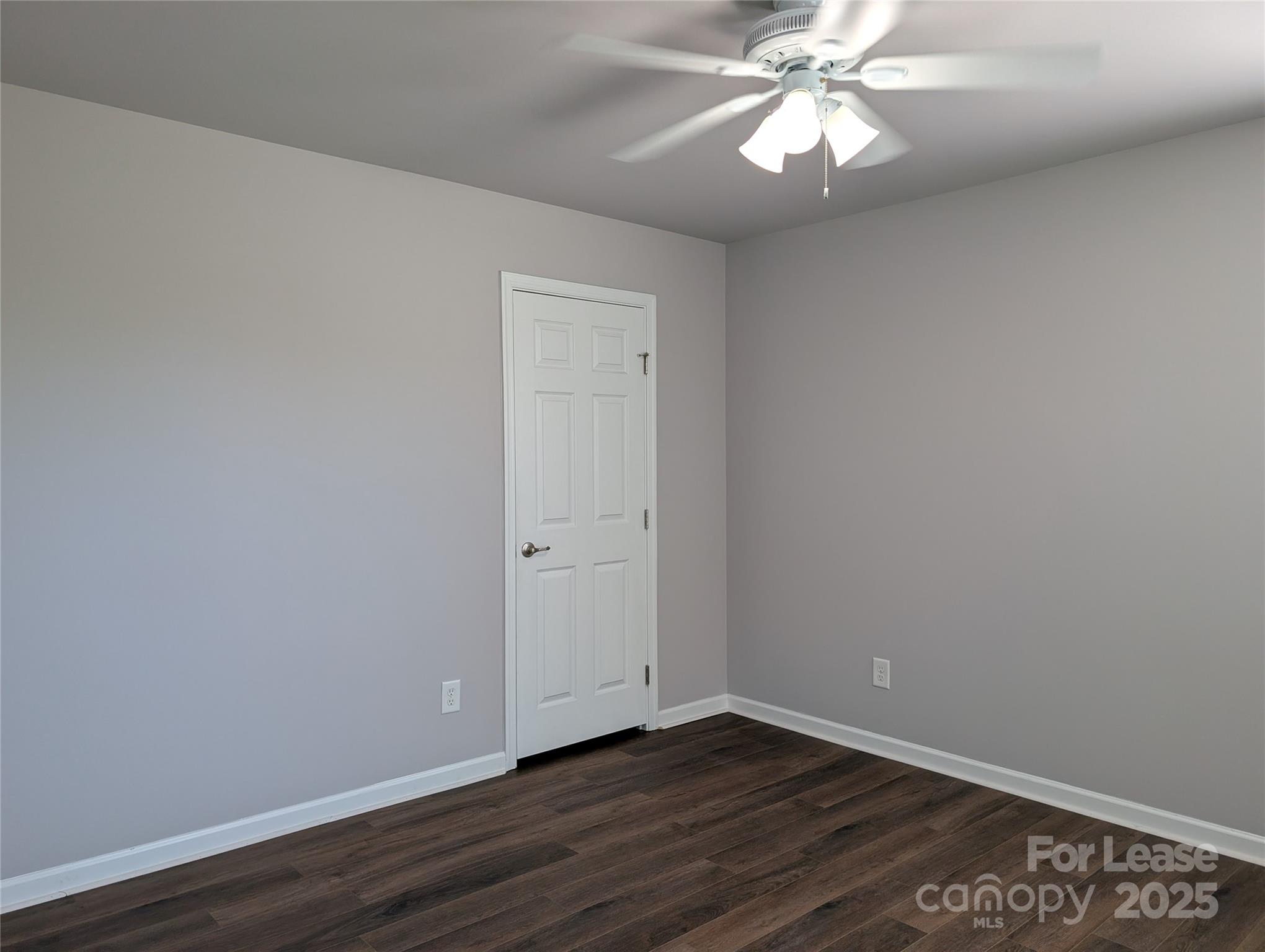4432 Roundwood Court Indian Trail, NC 28079 - Photo 16 of 25 a view of an empty room with wooden floor and a window