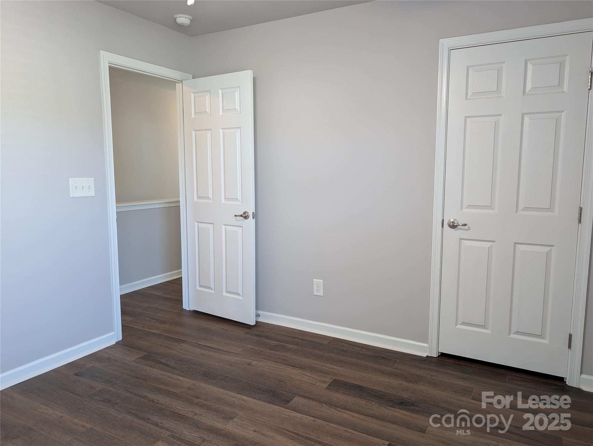 4432 Roundwood Court Indian Trail, NC 28079 - Photo 19 of 25 an empty room with wooden floor and closet area