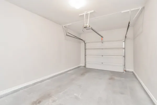 a view of room that has a white walls