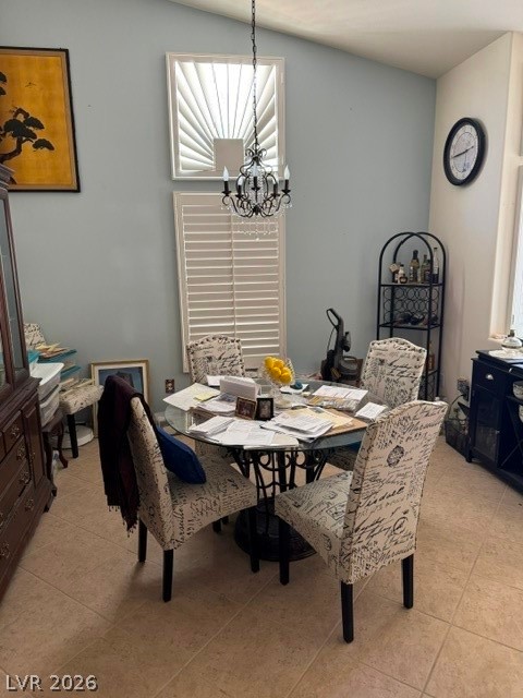 589 Beacon Ridge Way Mesquite, NV 89027 - Photo 6 of 18 This airy dining area showcases an elegant chandelier and tall windows, ideal for entertaining.