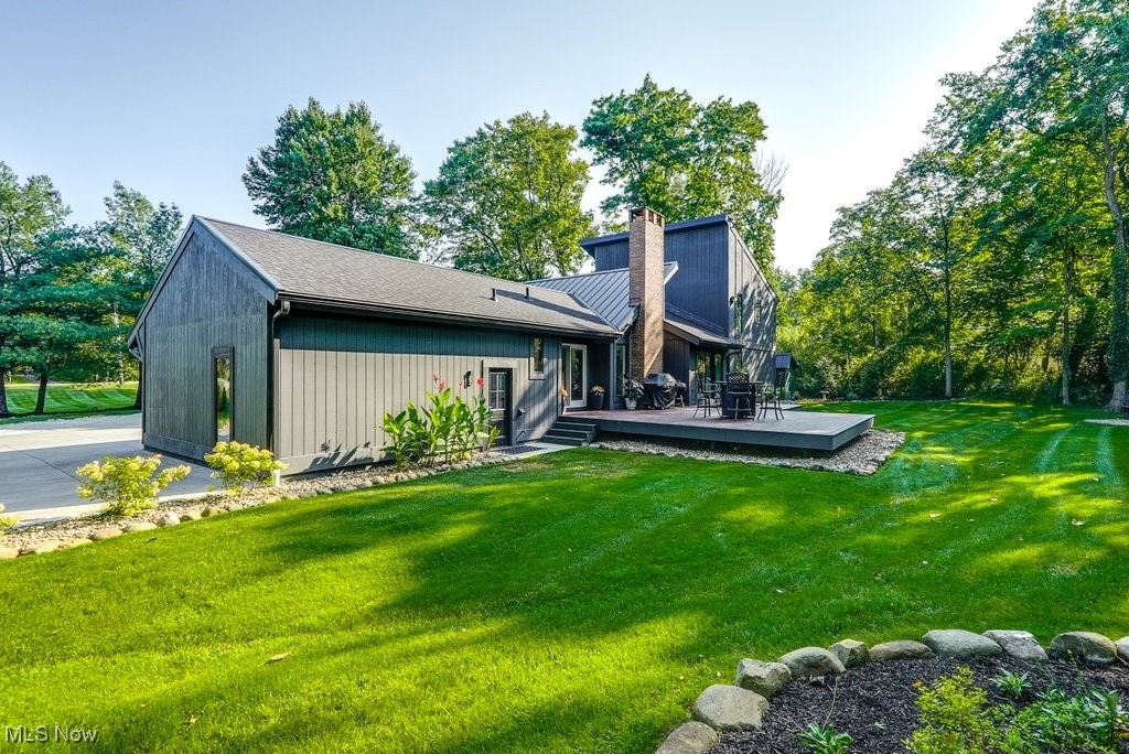1598 Graham Road Silver Lake, OH 44224 - Photo 5 of 46 Back of property featuring a lawn and a wooden deck