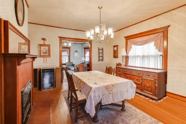 a hallway with cabinets and wooden floor