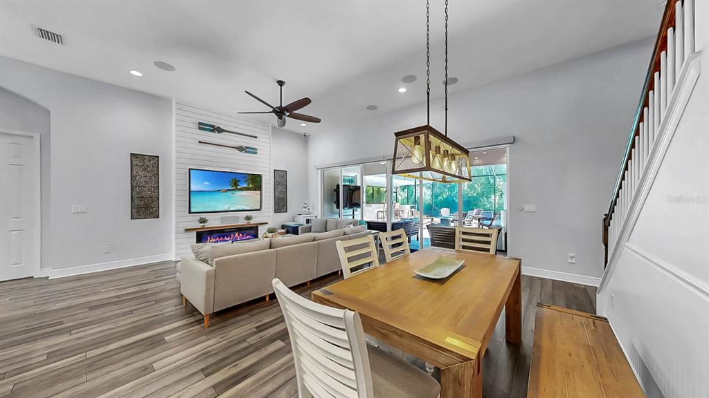 7709 Paradiso Drive Apollo Beach, FL 33572 - Photo 15 of 64 a living room with fireplace furniture and a flat screen tv
