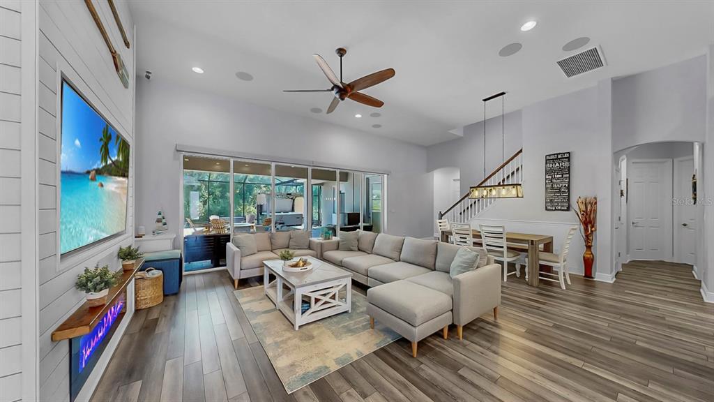 7709 Paradiso Drive Apollo Beach, FL 33572 - Photo 18 of 64 a living room with furniture and a flat screen tv