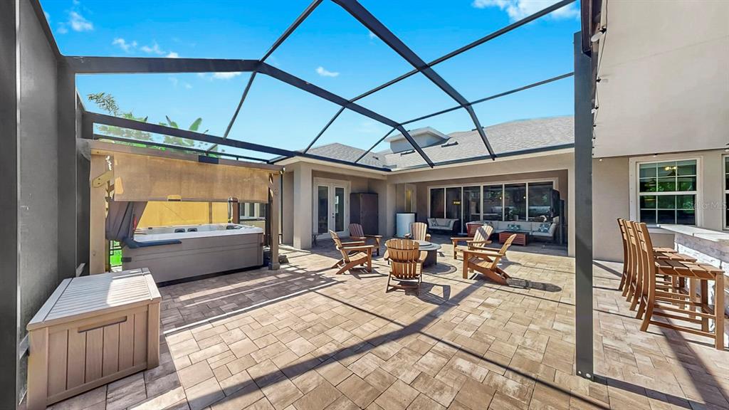 7709 Paradiso Drive Apollo Beach, FL 33572 - Photo 26 of 64 a building outdoor space with patio furniture and potted plants