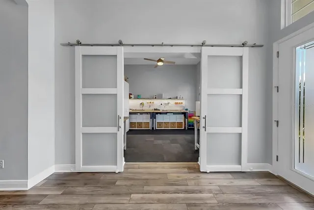 a bedroom with a large bed and a flat screen tv