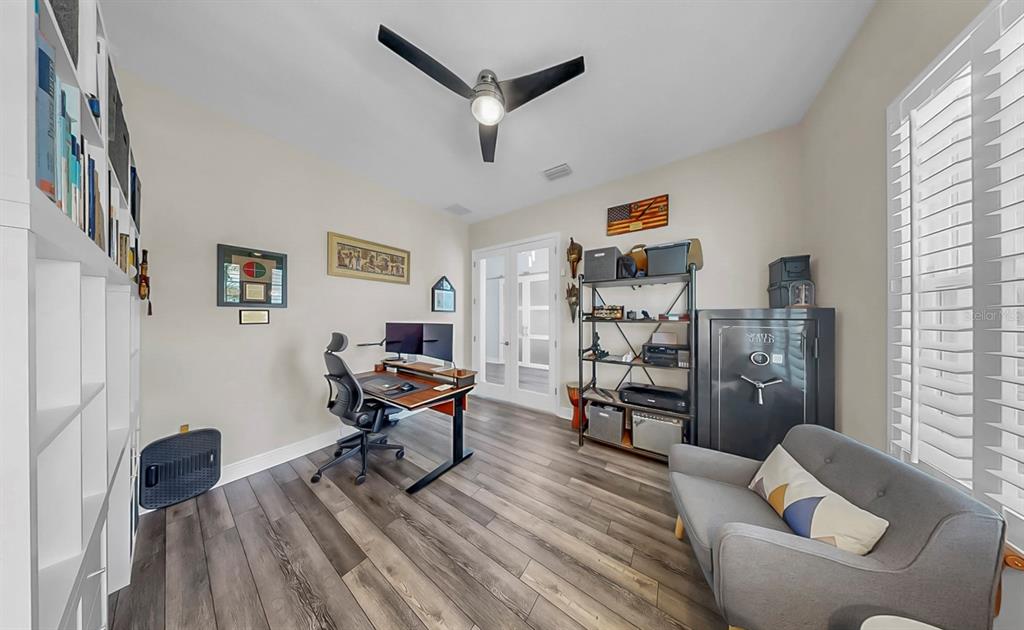 7709 Paradiso Drive Apollo Beach, FL 33572 - Photo 34 of 64 a living room with furniture and a wooden floor