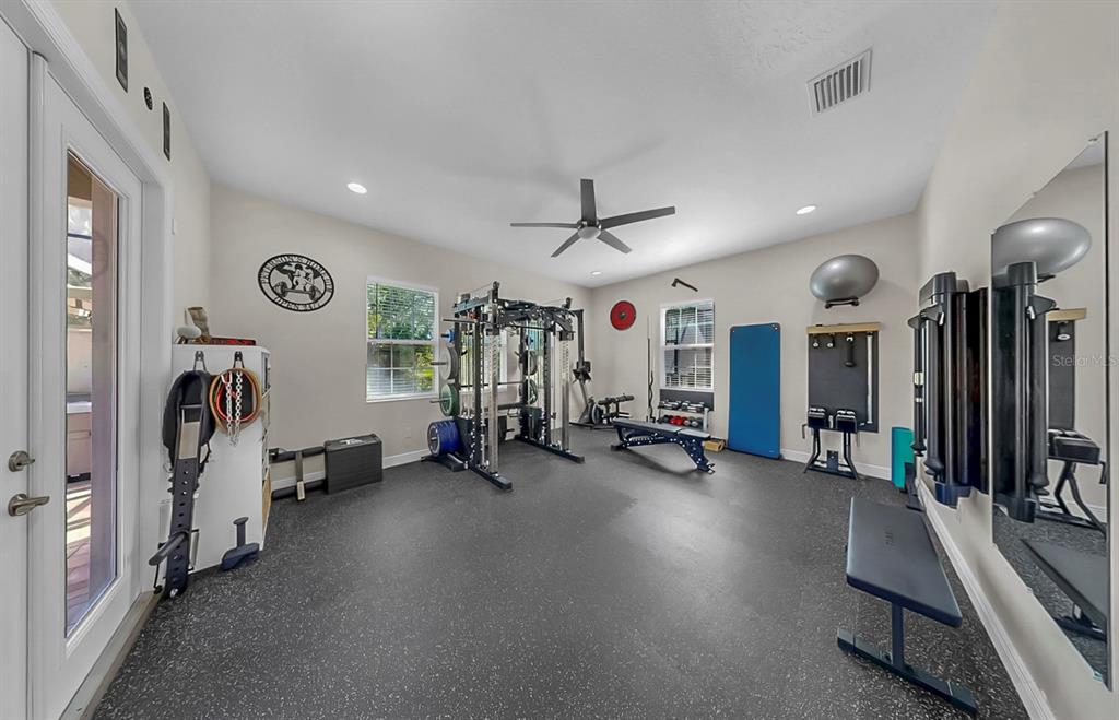 7709 Paradiso Drive Apollo Beach, FL 33572 - Photo 37 of 64 a view of a room with gym equipment